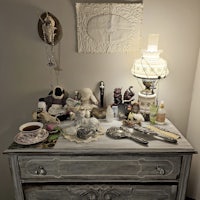 a dresser with a lot of items on it